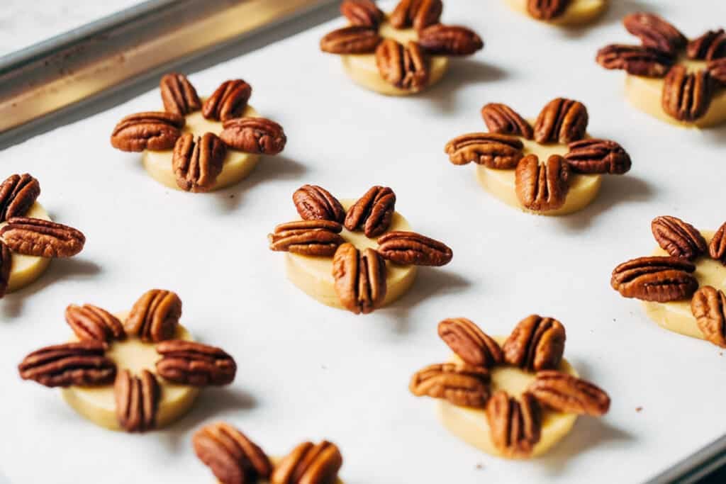 process shot of pecans on shortbread dough