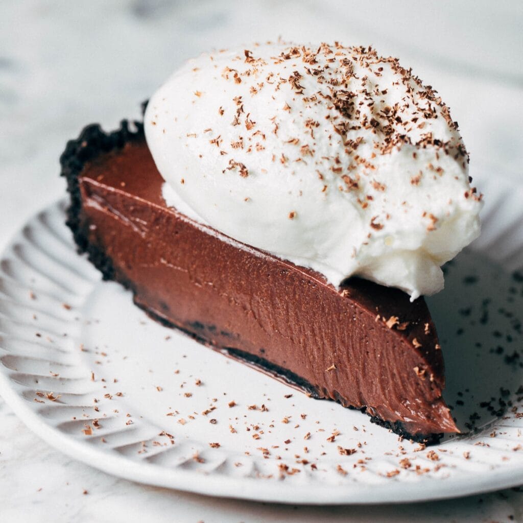 slice of chocolate pie topped with whipped cream