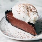 slice of chocolate pie topped with whipped cream