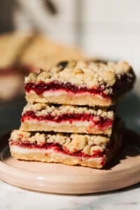 stacked raspberry cheesecake crumble bars