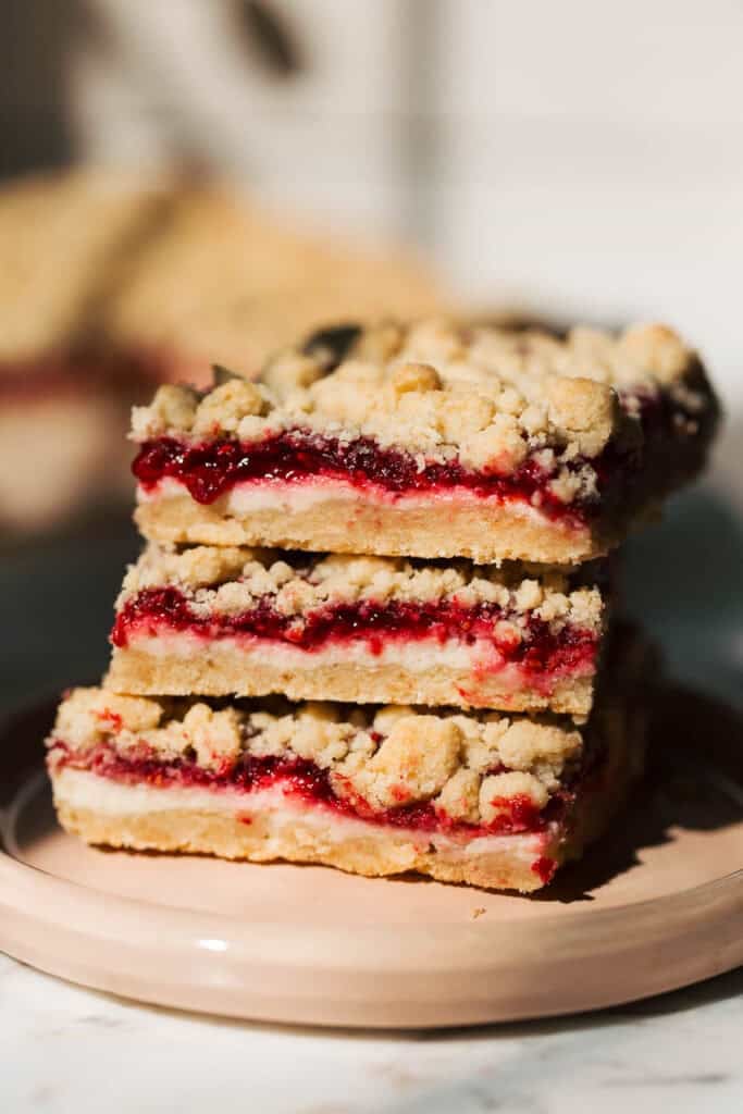 stacked raspberry cheesecake crumble bars
