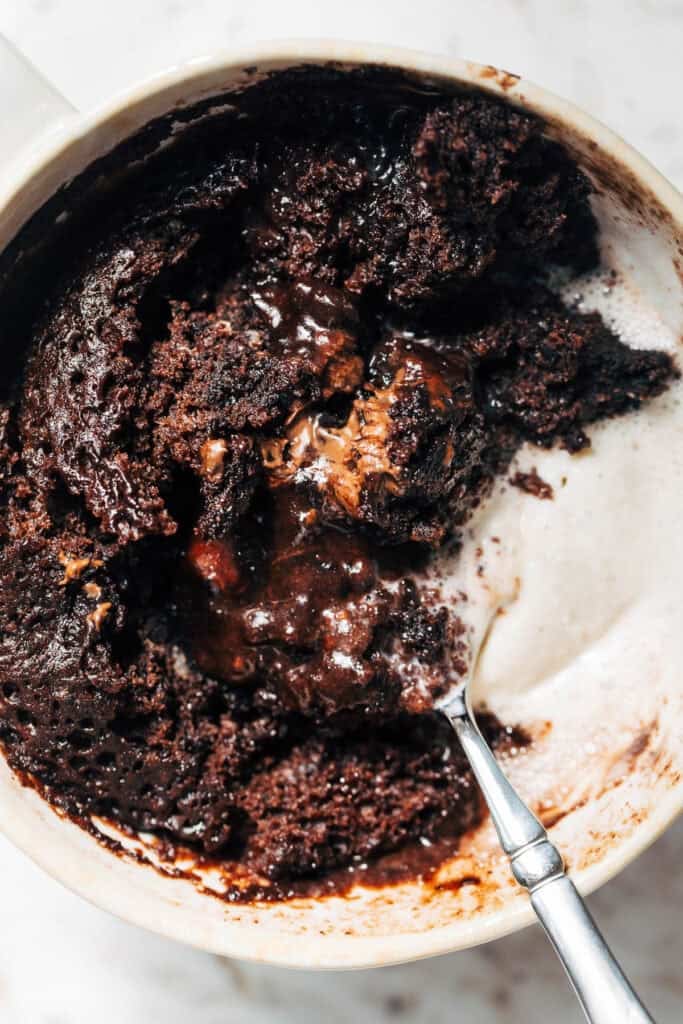 close up on chocolate mug cake with ice cream