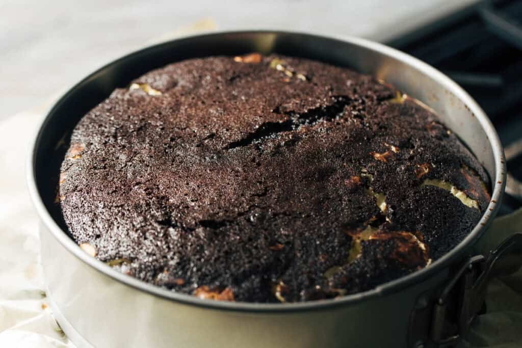 process shot of freshly baked cookies and cream cake