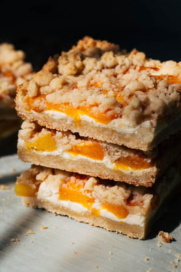 stacked peach cheesecake bars
