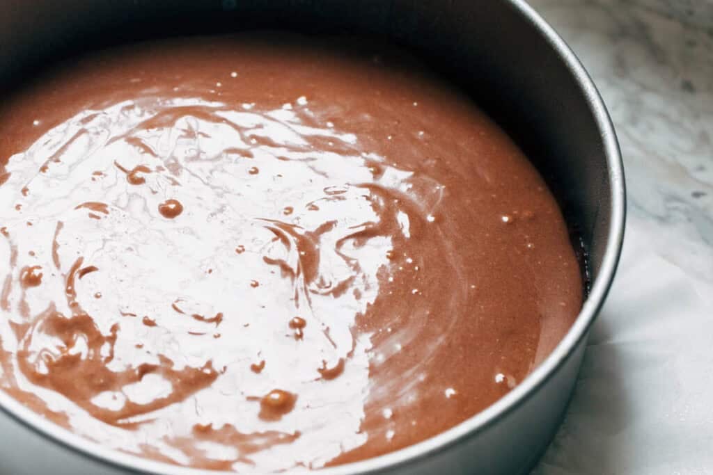 process shot of brownie batter layer