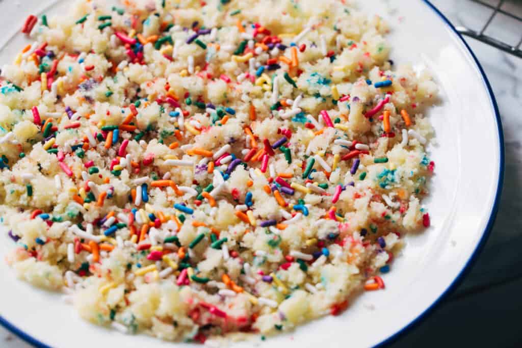 process shot mixing funfetti cupcake crumbles and sprinkles
