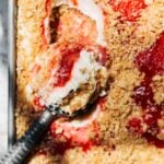 scooping into no bake cheesecake
