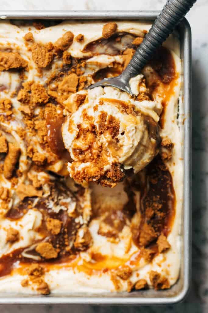 scooping salted caramel cheesecake