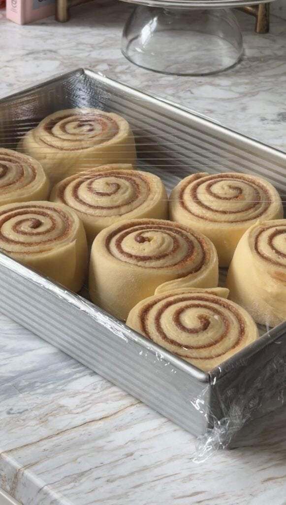 process shot of risen cinnamon rolls